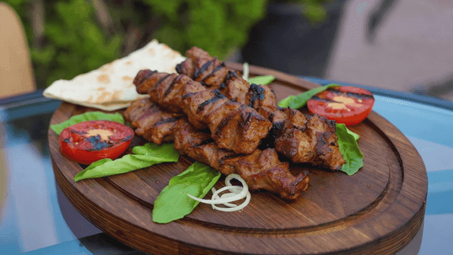Shashlik, grilled meat skewers with vegetables