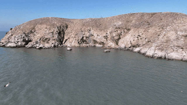 Rocky island surrounded by calm sea