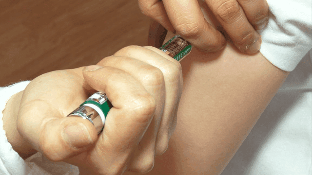 Administering an injection on the arm