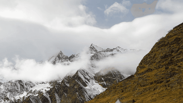 Cloudy, snow-covered mountains