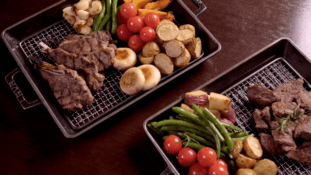 Grilled steak and vegetables on tray