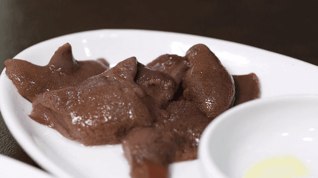 Fresh beef liver mushrooms on white plate