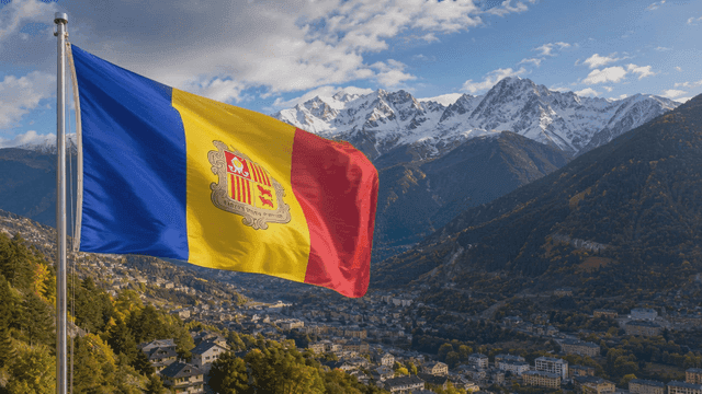Andorran flag fluttering over mountainous landscape