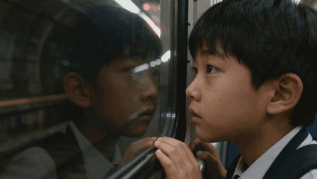 Boy looking out the subway window