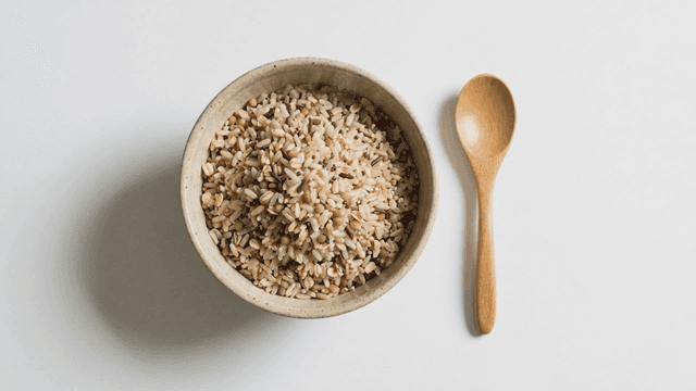 Mixed grain rice with wooden spoon