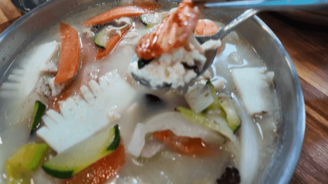 Jjamppong soft tofu topped with kimchi