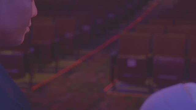 Lovers examining a pregnancy test in a dimly lit room