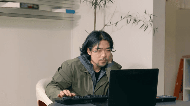 Man working on a laptop indoors