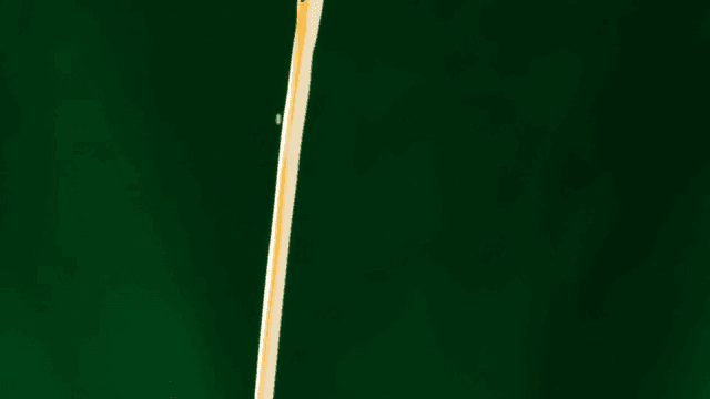 White milk and brown coffee poured against a green screen