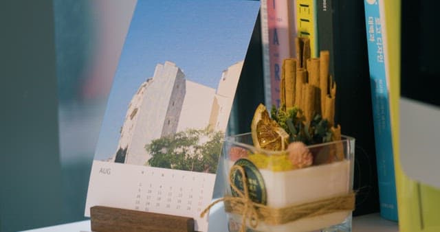 Desk with a Stylishly Designed Calendar and Bookshelf