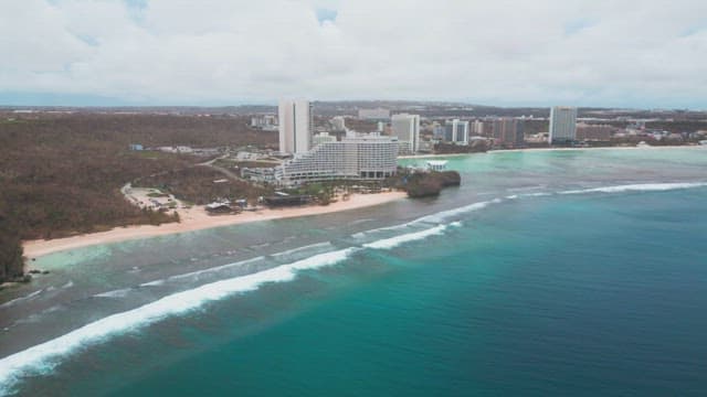 Coastal city with modern buildings and beach