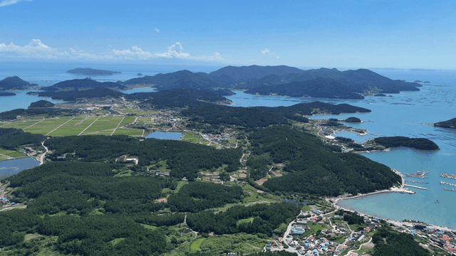 Aerial view of a coastal village and islands