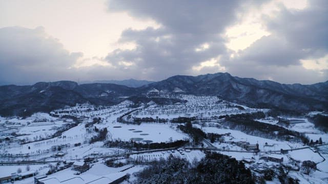 Snow-Covered Countryside at Dusk