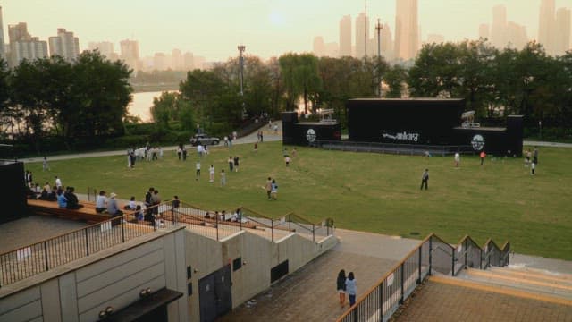 Evening view of a city park with people gathering