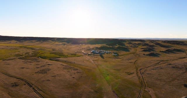 Vast landscape with yurts