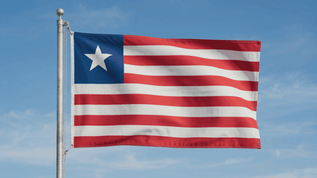 Liberian flag fluttering against clear sky