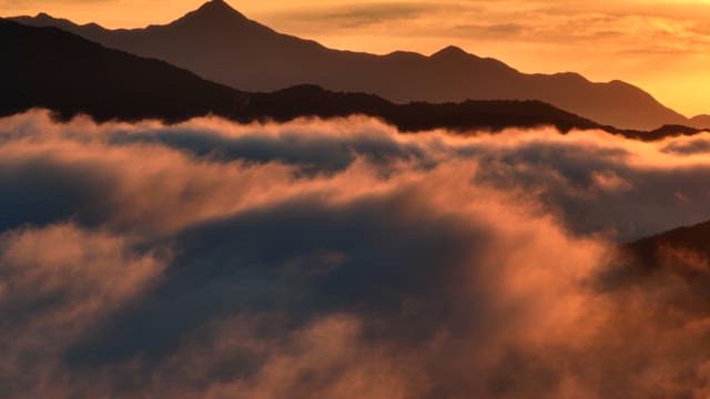 Mountains with clouds at sunrise