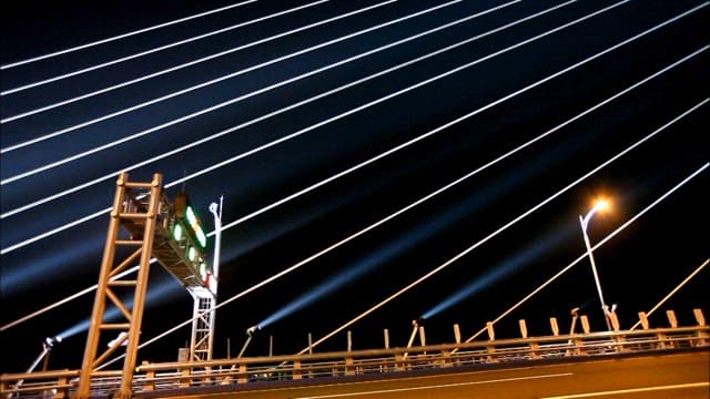 Illuminated Incheon Bridge at Night with Light Trails