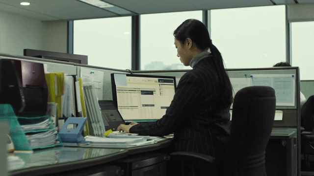 Office worker focused on computer tasks