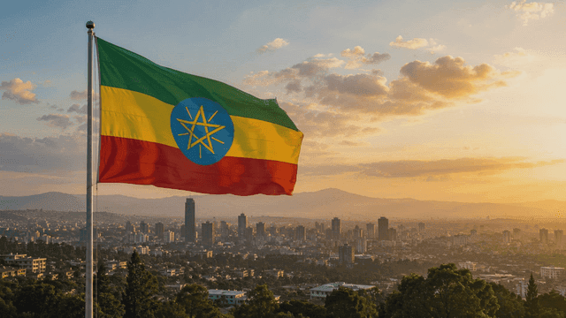 Ethiopian flag and city skyline at sunset