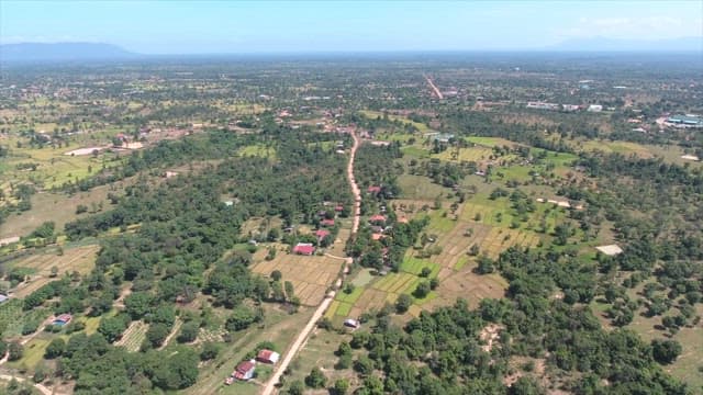 View of rural farmland and village