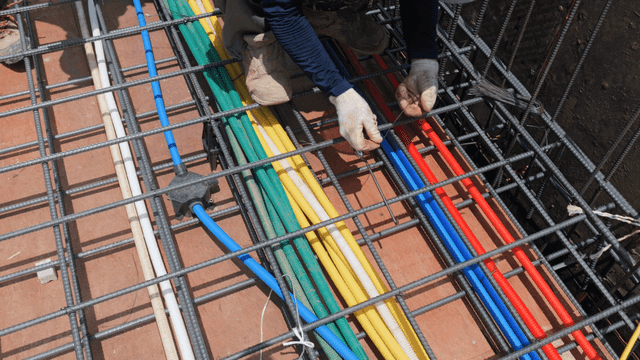 Workers installing colorful cables