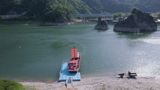 Serene River Landscape with Traditional Boat