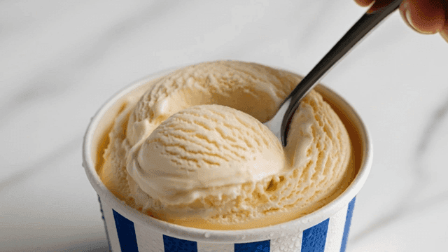 Vanilla ice cream scooped with spoon