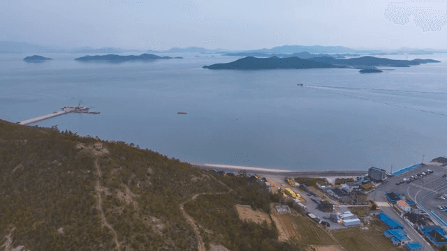 Coastal landscape with distant islands