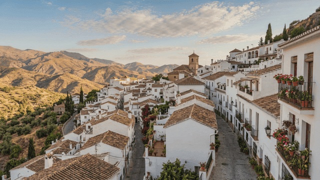Peaceful European village with white houses and mountains