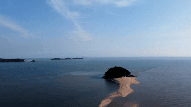 Small island surrounded by calm sea
