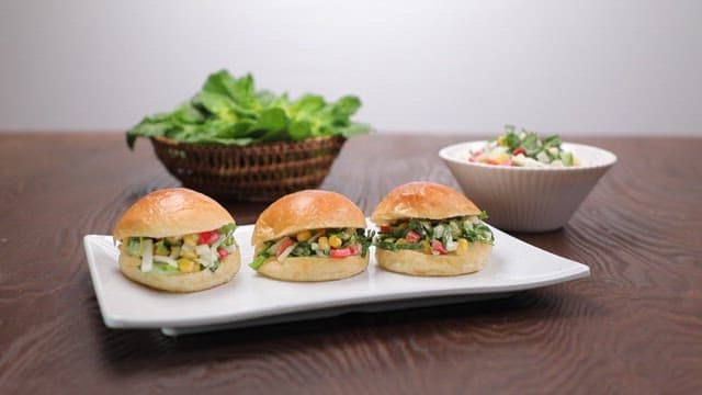 Spring cabbage sandwiches and coleslaw on the table