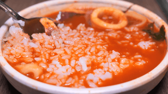 Rice mixed into spicy Korean stew with squid