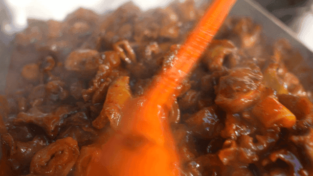 Spicy stir-fried pork intestines being cooked