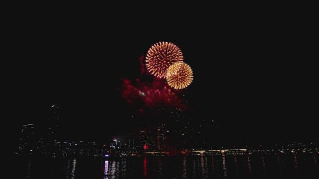 Colorful fireworks on river