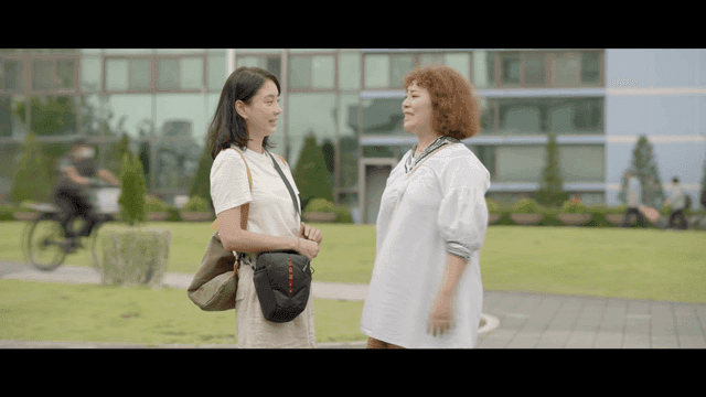 Two women talking on street