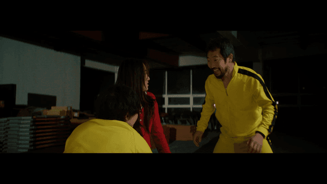 People in yellow tracksuit having a discussion