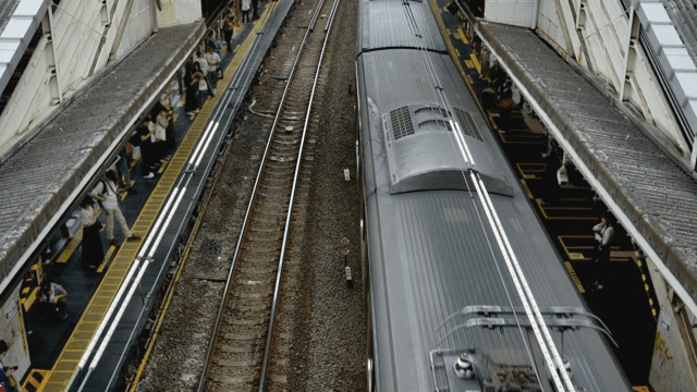Train arriving at a busy station platform