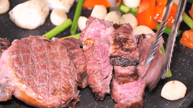 Grilled steak with vegetables on a pan