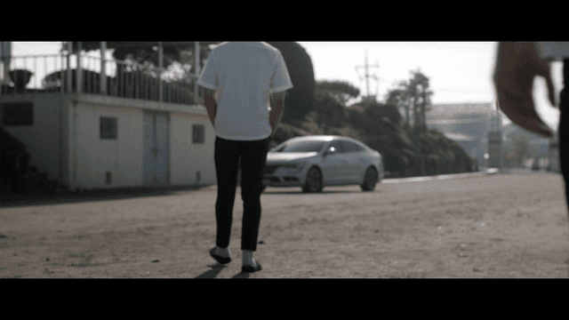 Two students approaching vehicle entering school