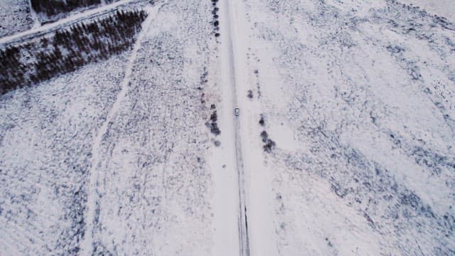 Car driving on a snowy road