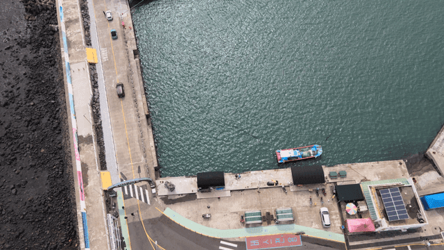 Aerial view of a coastal port with boats