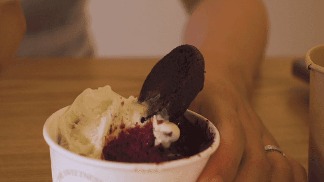 Hand scooping out gelato