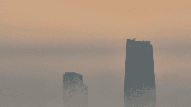 Foggy cityscape with tall buildings
