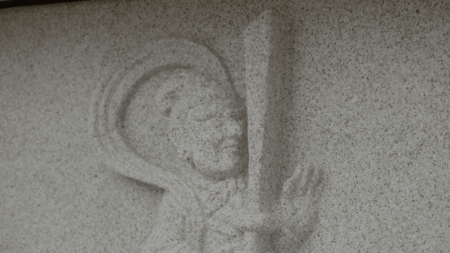 Stone carving of a traditional figure