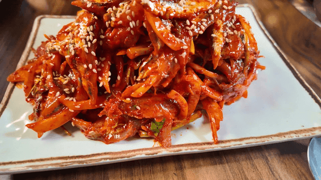 Plate full of spicy anchovy sashimi