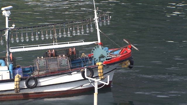 Fishing Boat Leaving a Peaceful Dock