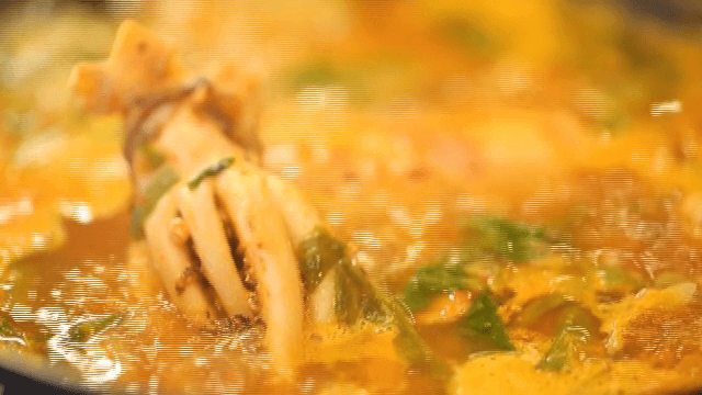 Bubbling pot of Spicy Seafood Stew with squid