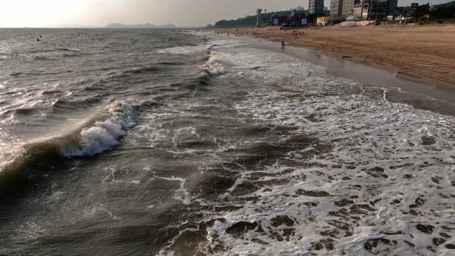 Waves crashing on a sandy beach