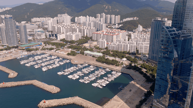 View overlooking a city marina with docked yachts